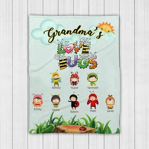 May include: A light blue blanket with the text "Grandma's Love Bugs" in colorful letters.  There are seven children dressed as bugs with their names below them: Ashley, Yaziel, Yarineth, Emily, Yadiel, Edwin, Matt, and Jariel.