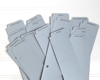 May include: A collection of light gray recipe dividers with various categories printed in black. Categories include Appetizers, Breads, Soups, Vegetables, Chicken/Turkey, Vegetarian, Ground Beef, Side Dishes, Pork, Beef, Breakfast, International, Holidays, Misc, Seafood, and Desserts.