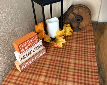Harvest Rust, Pumpkin and Brown tones 10" and 14" width many lengths.  100% cotton.  Adds beauty to any fall table