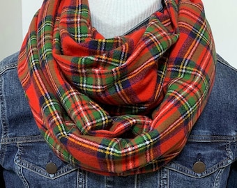 Red and Green Plaid (not Stewart Tartan) has more green for everyone on your list, fringed edges all around