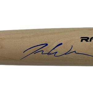 May include: A wooden baseball bat with a black and white Rawlings logo and the text "Pro" on the barrel. The bat is signed in blue ink.