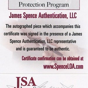 K&ouml;nnte beinhalten: Ein wei&szlig;es Zertifikat mit dem Text "The Witnessed Protection Program" und "James Spence Authentication, LLC". Das Zertifikat enth&auml;lt das JSA-Logo und die Zertifizierungsnummer "W SAMPLE". Das Zertifikat garantiert die Echtheit.