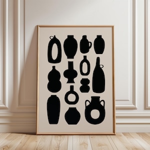 May include: A framed art print displaying black vase silhouettes on a beige backdrop. The vases are diverse in form and dimensions, offering a contemporary, minimalist design. The artwork is enclosed in a plain wooden frame, ideal for interior decoration.
