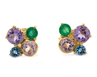 May include: A pair of gold earrings with a cluster of colorful gemstones. The earrings feature amethyst, emerald, rose quartz, and blue topaz.