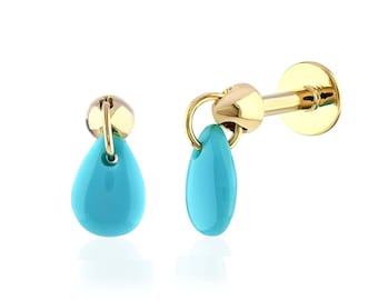 May include: A pair of gold earrings with a teardrop-shaped, turquoise-colored stone pendant. The earrings have a post and a small loop connecting the pendant to the gold setting. The background is white.