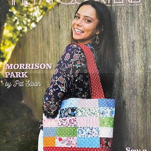 May include: A magazine cover featuring a woman holding a red tote bag with a patchwork design. The magazine is titled "The Fat Quarterly" and the tote bag is labeled "Sew a Tote Bag with your swatch pack".