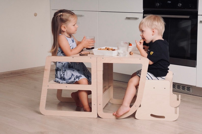 Learning tower and  Feeding chair combo  that transforms into a kids desk  and an extra chair.