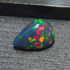 Black Ethiopian Opal Cabochon: Flashy Welo Fire Gemstone, 2.20 ct, 11x8 mm