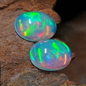 Ethiopian Opal Ethiopian Opal Cabochon Pair Size 7x5 MM Top Brilliant "RED + GREEN" Full Flashy Multi Fair Opal Pair For Loose Jewelry Uses
