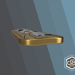 Puede incluir: Un accesorio de metal de color dorado con un dise&ntilde;o plateado. El accesorio tiene una forma ligeramente curvada y una superficie texturizada.
