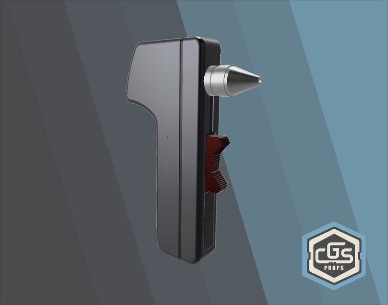 Peut inclure: Un appareil portable noir avec une pointe argent&eacute;e et un levier rouge. L'appareil est fabriqu&eacute; par CGS Props.