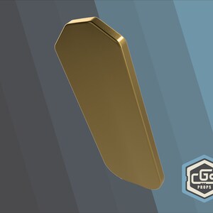 Puede incluir: Una placa de metal octogonal de color dorado. La placa es lisa y tiene un borde ligeramente redondeado.