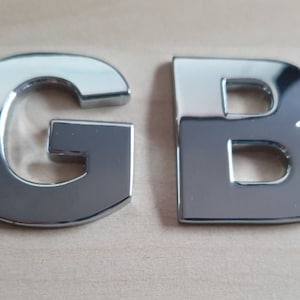 Insignia con letras autoadhesivas para coche, nueva, de gran calidad, en cromo plateado GB, 3D.