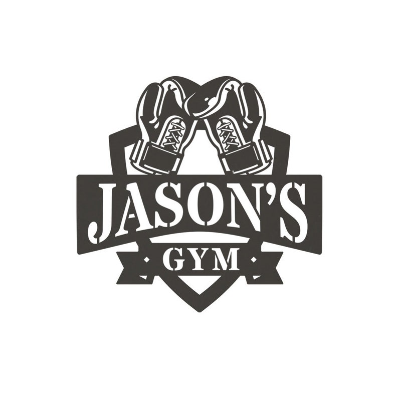May include: Black and white logo for a gym called "Jason's Gym". The logo features a shield with two boxing gloves crossed inside. The text "Jason's Gym" is written in a bold, blocky font.