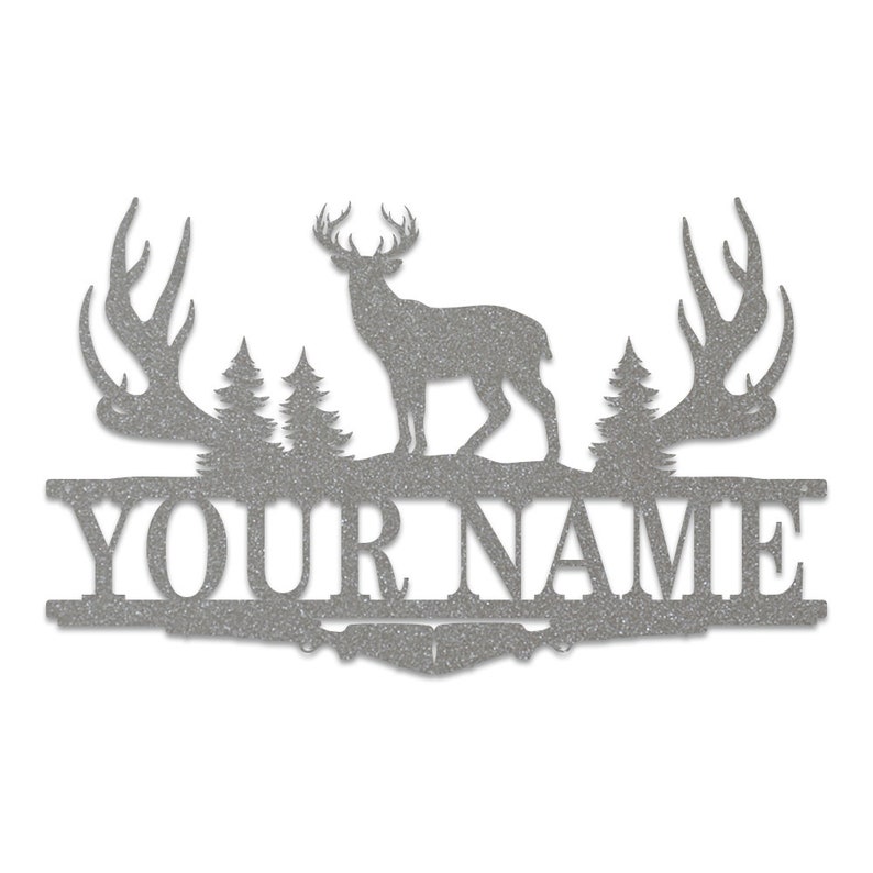 May include: A silver metal sign with a deer silhouette, two trees, and antlers on either side. The sign says "YOUR NAME" in a decorative font.