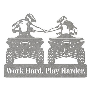 May include: A black and white silhouette of two people riding quad bikes, holding hands. The text "Work Hard. Play Harder." is below the image.