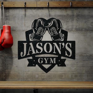May include: Black metal sign with a boxing glove design and the text "JASON'S GYM".