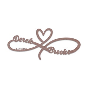 May include: A brown wooden infinity symbol with a heart in the centre. The names "Derek" and "Brooke" are written on either side of the heart, with the date "8.17.2013" below "Derek".