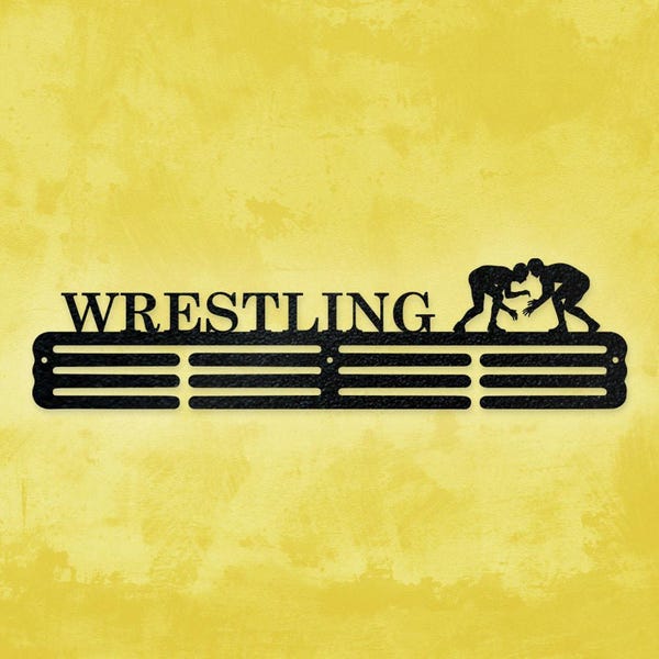 May include: A black metal wall-mounted display rack featuring the word WRESTLING in capital letters and a silhouette of two figures grappling. The rack includes three horizontal bars designed for hanging medals or other small items.