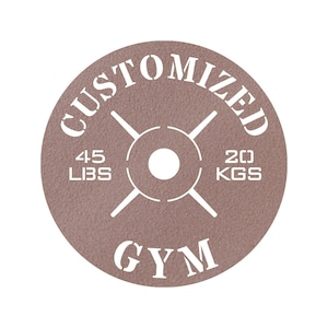 May include: A brown weight plate with white text that reads "CUSTOMIZED GYM" and "45 LBS 20 KGS".