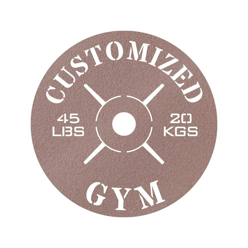 May include: A brown weight plate with white text that reads "CUSTOMIZED GYM" and "45 LBS 20 KGS".