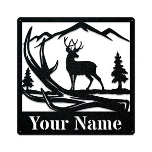 May include: Black metal silhouette of a deer standing in front of a mountain range with antlers in the foreground. The text "Your Name" is at the bottom of the image.