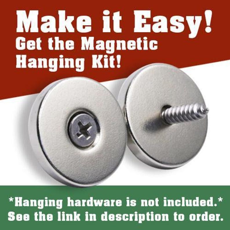 The image is an advertisement for a magnetic hanging kit, featuring a pair of silver-colored magnets with screws and a screwdriver. The text on the image reads "Make it Easy! Get the Magnetic Hanging Kit!" and includes a warning that "Hanging hardware is not included. See the link in description to order."