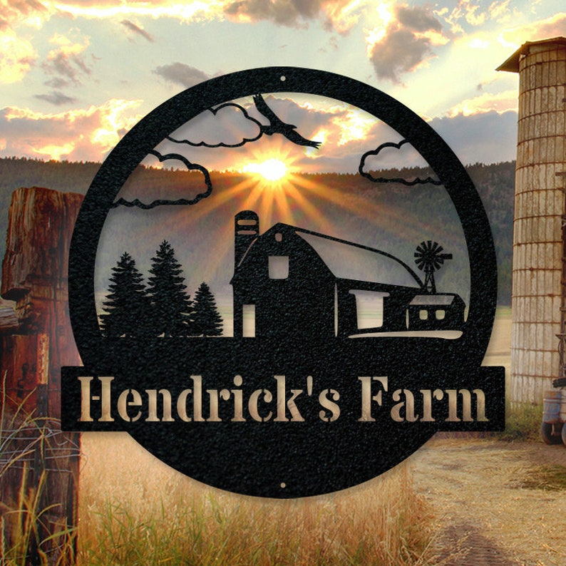 May include: Black metal sign with a silhouette of a barn, trees, and a sunset. The sign reads "Hendrick's Farm".