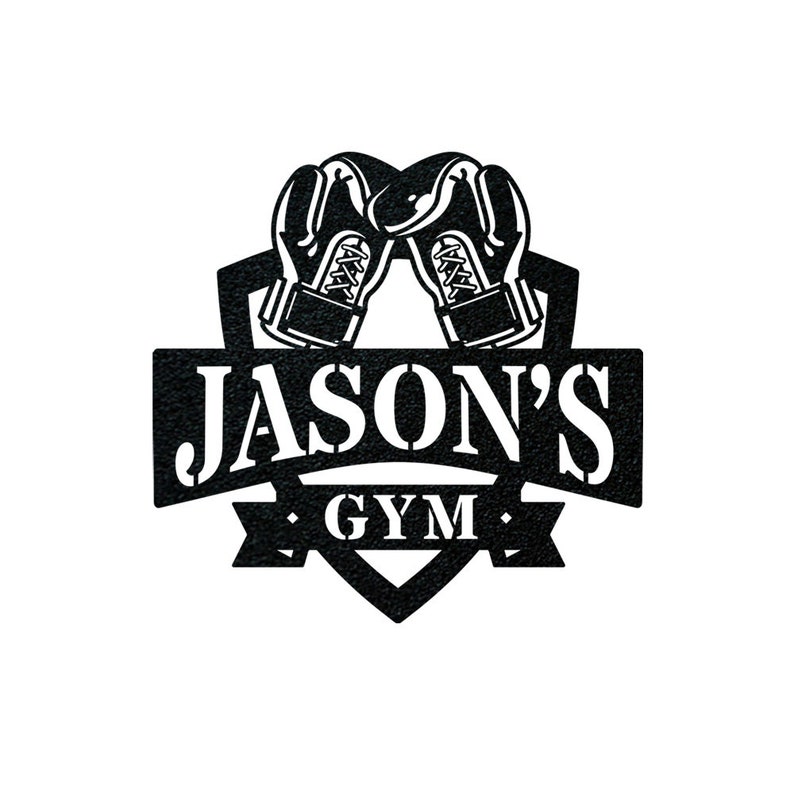 May include: Black and white logo with a heart-shaped shield. Two boxing gloves are crossed at the top of the shield. The text "JASON'S GYM" is on a banner below the shield.