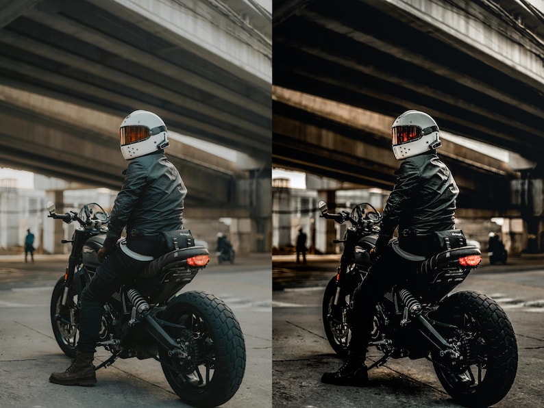 May include: A rider wearing a white full-face helmet with an orange visor and a black leather jacket sits on a black motorcycle. The motorcycle features a textured seat, a rear tail light, and thick tread tires, positioned under a concrete bridge.