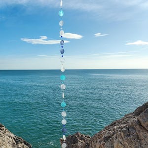 Suncatcher garland of capiz shells and glass beads, mobile hanging decor, coastal decorative ornament
