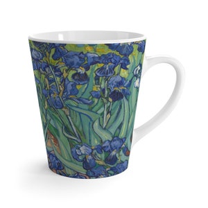 May include: A white ceramic latte mug with a colorful image of blue irises and green leaves. The image is a reproduction of a famous painting by Vincent van Gogh.