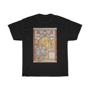 May include: Black t-shirt featuring a medieval illustration. The artwork depicts a scene with figures in armor, a kneeling person, and a person holding a sword. The background includes a building with arched windows and a gold-colored border.