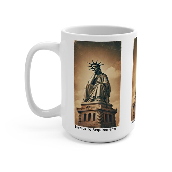 Surplus to requirements, White 15oz Ceramic Mug.  The Statue of Liberty has been fired. Liberty in Distress. Immigration art.