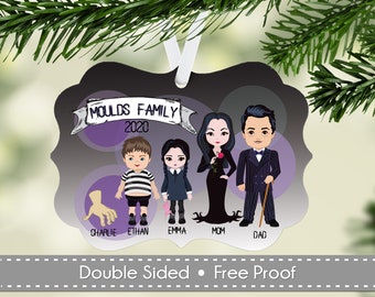May include: A black and white Christmas ornament featuring a cartoon family of five with the text "Moulds Family 2020". The family is dressed in black and white clothing and has a gothic theme. The ornament is double-sided.