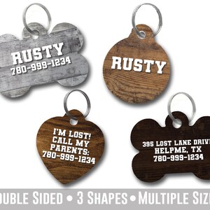 May include: Four different dog tag designs with a wood grain pattern. The tags are in the shapes of a bone, a circle, and a heart. The tags have the text "RUSTY" and a phone number on them. The tags are double-sided and come in multiple sizes.