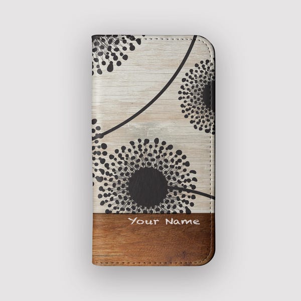 May include: A white and brown phone case with a wood grain pattern and black dandelion designs. The bottom of the case is brown wood and has the text "Your Name" written on it.