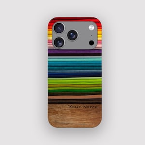 May include: A phone case with a colorful design. The top portion features a rainbow of colors, transitioning into a gradient of blues, greens, and browns. The bottom has a wood grain texture with the text "Your Name".