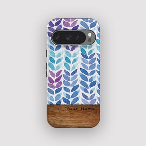 May include: A phone case with a watercolor leaf pattern in shades of purple and blue. The top portion has a camera cutout. The bottom is a wood grain texture with the text "Your Name".