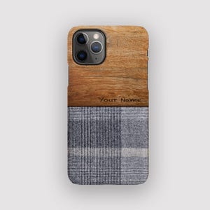 Charcoal Cross Phone Case: Tweed Effect Grey Material iPhone 17 Case Design.