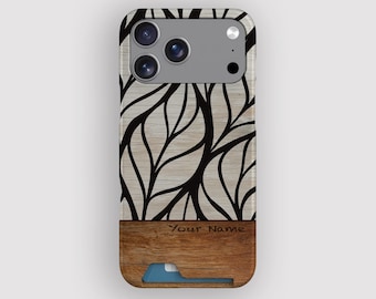 May include: A smartphone case with a wood grain design and a black leaf pattern. The case has a wooden bottom with a card slot and the text "Your Name". The case is designed to fit a smartphone.