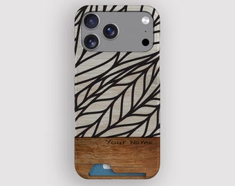 May include: A phone case with a wooden design. The top half features a light wood grain pattern with black leaf-like lines. The bottom half is a darker wood with a card slot and the text "Your Name".