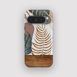 May include: A phone case with a botanical design. The case has a white background with brown, green, and gold leaf patterns. The bottom section has a wood grain texture with the text "Your Name".
