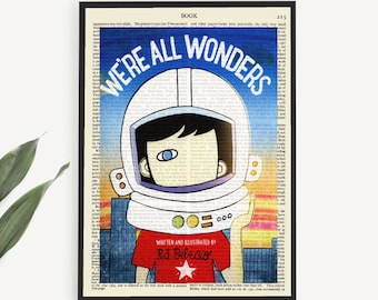 May include: A printable book art print featuring a vintage book page with an illustration of a child wearing an astronaut helmet. The text on the page reads "We're All Wonders" and "Written and Illustrated by RJ Palacio".
