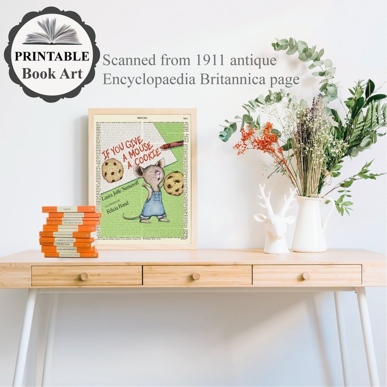 May include: A framed print of a vintage book page featuring an illustration of a mouse holding a cookie. The text on the page reads "If you give a mouse a cookie".