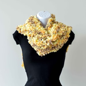 Hand knit chunky scarf in yellow and walnut with tiny pom poms