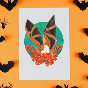 May include: A brown and black bat with white fur on its chest is depicted in a watercolor painting. The bat is surrounded by orange flowers and a blue and green background.