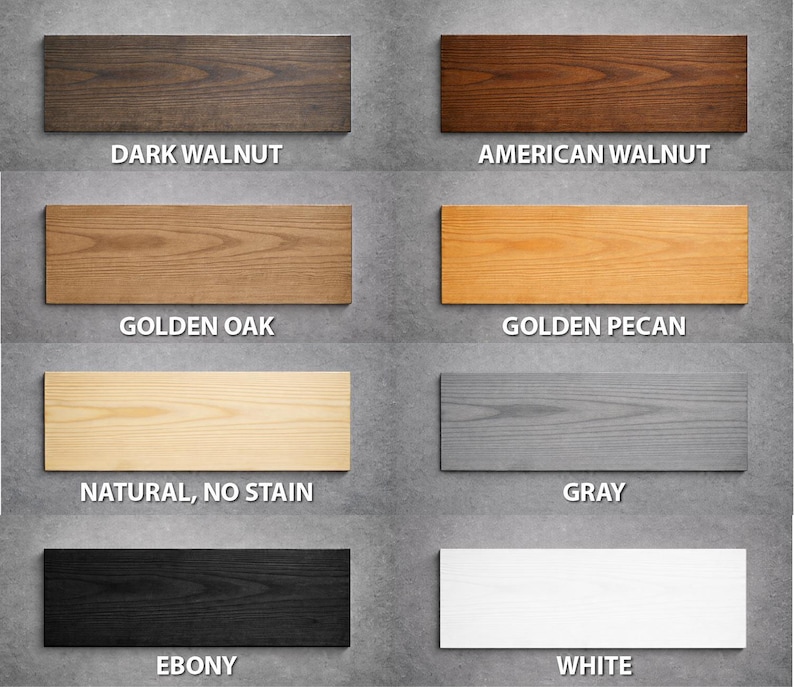 May include: A collection of eight rectangular wood samples showcasing various finishes. The samples include Dark Walnut, American Walnut, Golden Oak, Golden Pecan, Natural (No Stain), Gray, Ebony, and White, each labeled with its name.