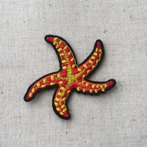 May include: Red and yellow embroidered starfish patch.