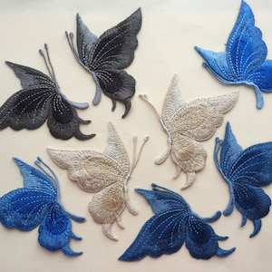 Puede incluir: Seis parches bordados con forma de mariposa en varios colores, incluyendo azul, negro y beige. Los parches son perfectos para añadir un toque de fantasía a la ropa, los bolsos u otras manualidades.